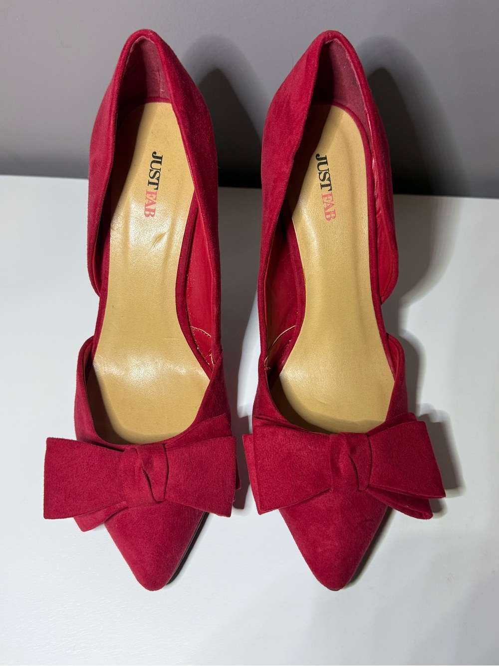 JustFab Red Pointed-Toe Heels with Bow Accent